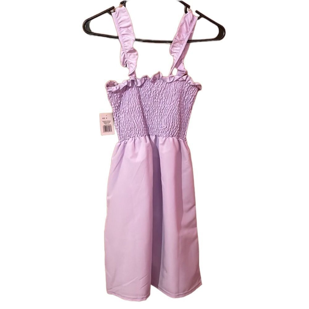 •BOUQITUE STYLE 5• NWT lavender colored smocked ruffle dress size medium.